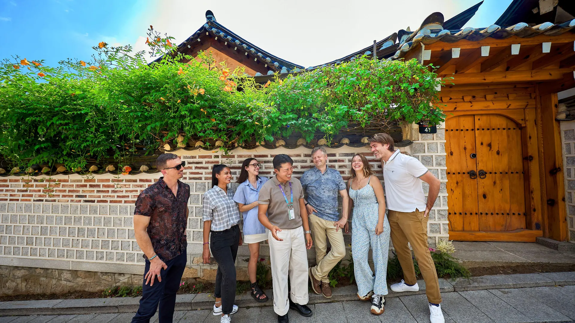 A tour group with their guide in a lane of hanok houses in Bukchon, from the Bukchon and Gyeongbokgung tour listing